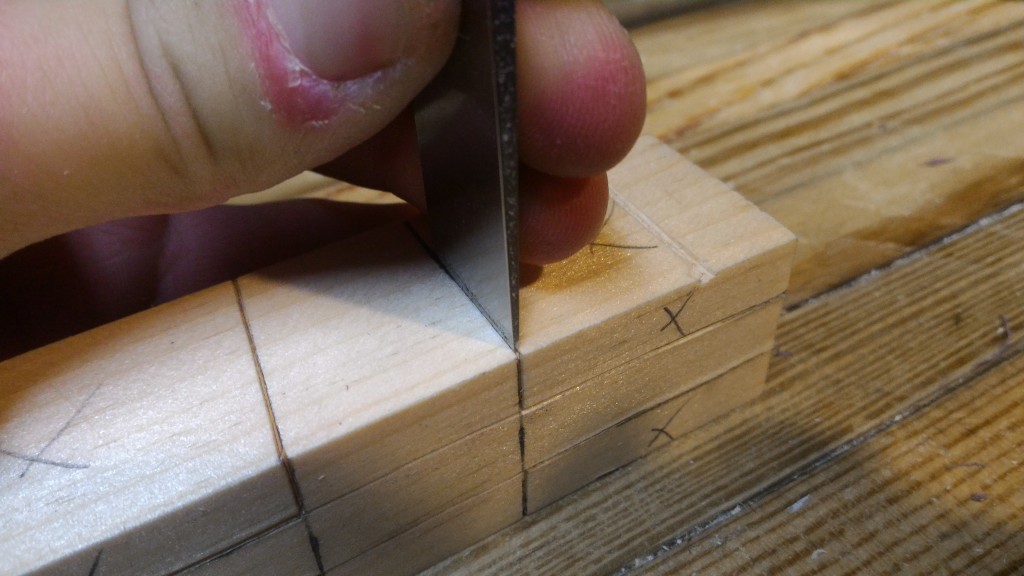 Using a chisel to mark a knife line